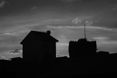 Low angle view of building against cloudy sky