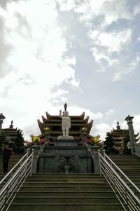 Low angle view of statue against sky