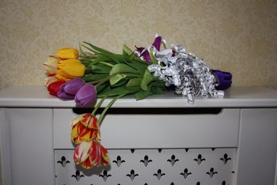 Close-up of multi colored tulips in vase