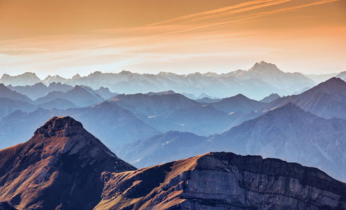 Scenic view of mountains against sky during sunset