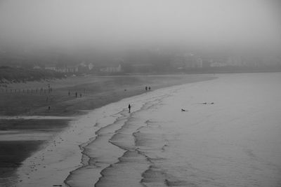 Scenic view of frozen sea against sky during winter