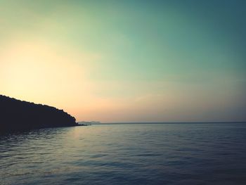 Scenic view of sea against sky at sunset