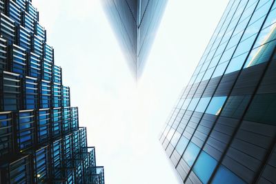 Low angle view of tall buildings against clear sky