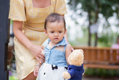 Portrait of happy mother holding baby