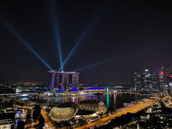 Illuminated buildings in city at night