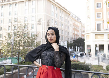 Portrait of young beautiful woman wearing black hijab