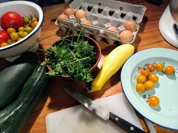 High angle view of fruits and vegetables on cutting board