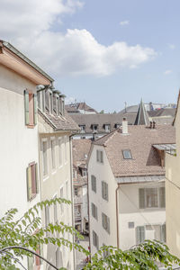 Houses in town against sky