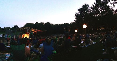 Rear view of people enjoying music concert
