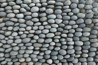 Full frame shot of pebbles arranged on pathway