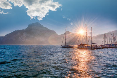 Sailboat sailing on sea against sky