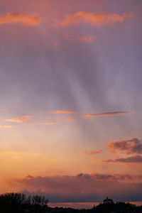 Low angle view of dramatic sky during sunset