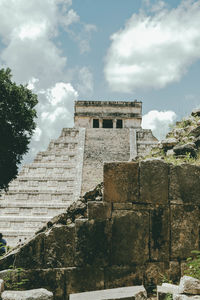 Low angle view of historic building against cloudy sky