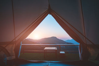 View of mountains against clear sky during sunset