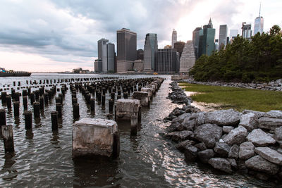 Scenic view of sea by city against sky