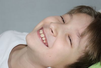 Close-up portrait of smiling boy