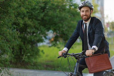 Portrait of young man riding bicycle