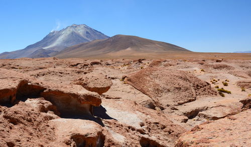 Scenic view of desert against clear sky