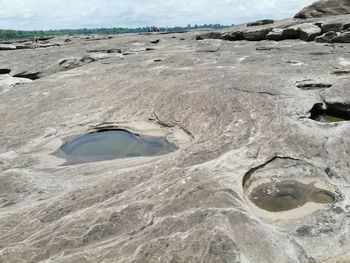 High angle view of water flowing through rocks