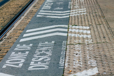 High angle view of road sign on street