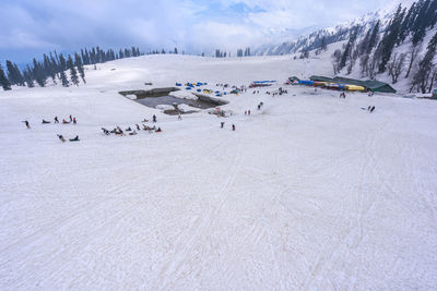 Group of people on snow covered land