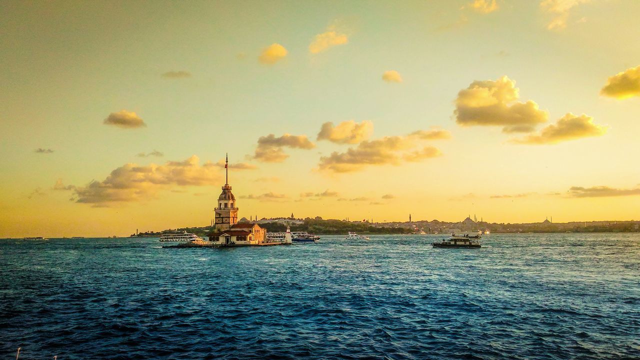 sunset, water, waterfront, sea, nautical vessel, orange color, mode of transport, sky, boat, rippled, scenics, nature, beauty in nature, sailing, tranquil scene, tranquility, sailboat, outdoors, no people, idyllic, cloud - sky, travel destinations, sun, ocean, cloud