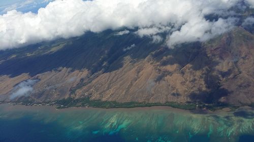 Aerial view of lake and mountains against sky