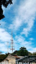Low angle view of building against cloudy sky