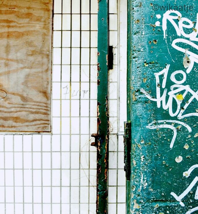 text, graffiti, communication, wall - building feature, western script, built structure, architecture, close-up, full frame, wall, metal, blue, backgrounds, weathered, capital letter, textured, art, paint, door, rusty