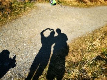 Shadow of man on field