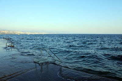 Scenic view of sea against clear blue sky