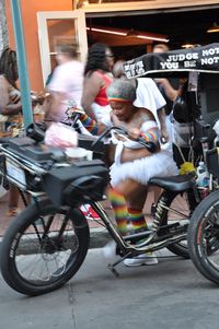 People riding bicycle on street