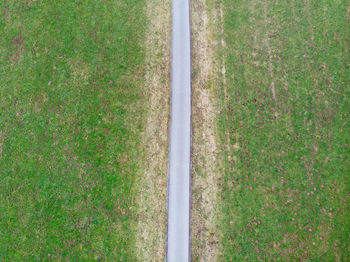 High angle view of road amidst field