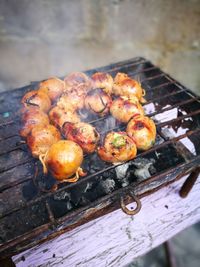 High angle view of meat on barbecue grill