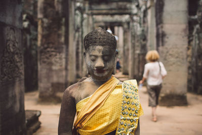 Statue against temple outside building