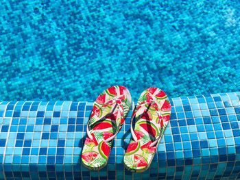 High angle view of slippers at poolside