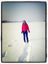 Full length of woman standing on shore