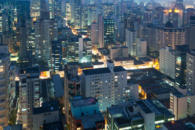 High angle view of illuminated buildings in city