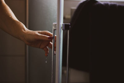 Close-up of hand on door at home