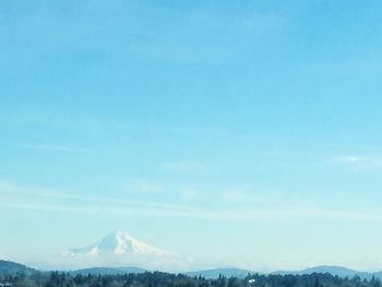 Scenic view of mountains against clear blue sky