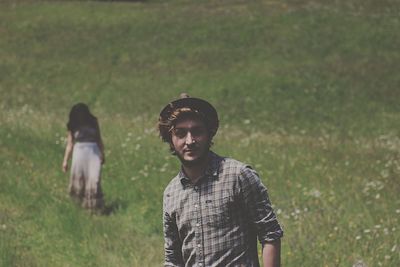 Portrait of man standing on field