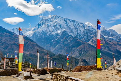 Flags against mountains and sky