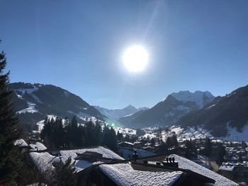 Scenic view of mountains against clear sky during sunny day