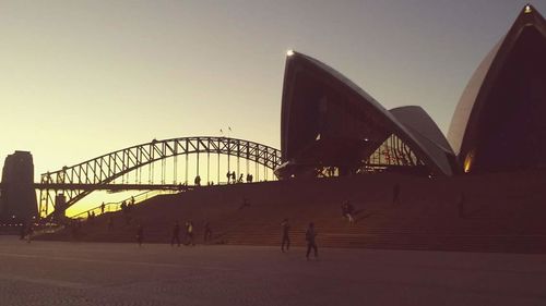 View of bridge in city against clear sky