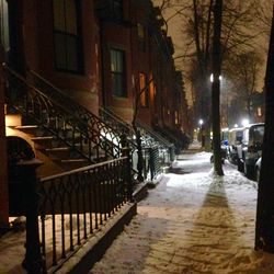 Illuminated city street at night