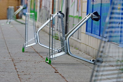 Metal railing on footpath in city