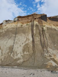 Rock formation on land against sky