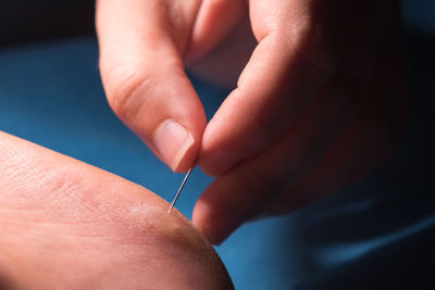 Close-up of person holding hands