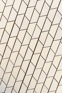 Angled white tile pattern perspective close up background
