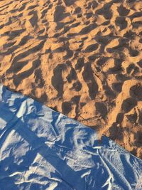 High angle view of shadow on sand at beach